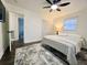 Well-lit bedroom features a ceiling fan, an area rug and a closet at 1329 Camp Rd, Charleston, SC 29412
