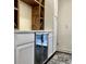 Close-up view of a built-in dry bar with wine rack and mini fridge at 1329 Camp Rd, Charleston, SC 29412