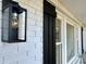 Close-up of the front of the house featuring shutters and lantern at 1329 Camp Rd, Charleston, SC 29412