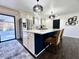 Updated kitchen with island, stainless steel fridge, and outdoor access at 1329 Camp Rd, Charleston, SC 29412