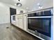 Kitchen island featuring oven and microwave with white cabinets and dark hardware at 1329 Camp Rd, Charleston, SC 29412
