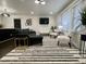 Cozy living room with a sectional sofa, striped rug, and natural light at 1329 Camp Rd, Charleston, SC 29412