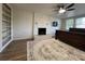 Bedroom with brick fireplace, ceiling fan and built in bookshelf at 1329 Camp Rd, Charleston, SC 29412
