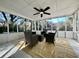 Cozy sunroom with floor-to-ceiling windows and wicker furniture at 1329 Camp Rd, Charleston, SC 29412