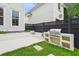 Modern backyard with a built-in grill and seating area, perfect for outdoor gatherings at 1474 Blue Cascade Dr, Mount Pleasant, SC 29464