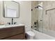 Modern bathroom features a glass shower and dark fixtures, complimented by neutral tile and a wooden vanity at 1474 Blue Cascade Dr, Mount Pleasant, SC 29464