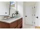 Stylish bathroom features a marble countertop, wood vanity, modern fixtures and ample lighting at 1474 Blue Cascade Dr, Mount Pleasant, SC 29464