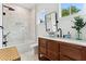 Charming bathroom featuring modern fixtures, stylish tile, and a soaking tub beneath a large window at 1474 Blue Cascade Dr, Mount Pleasant, SC 29464