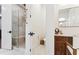 A bathroom showing an entrance with a tiled shower, toilet, and vanity area with a mirror at 1474 Blue Cascade Dr, Mount Pleasant, SC 29464