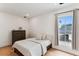 Bright bedroom with wood floors, large window, and a dresser for ample storage at 1474 Blue Cascade Dr, Mount Pleasant, SC 29464