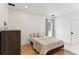 Cozy bedroom featuring a minimalist bed with soft linens, natural light, and neutral decor creating a serene space at 1474 Blue Cascade Dr, Mount Pleasant, SC 29464