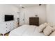 Comfortable bedroom showcasing a dresser, TV, and natural light streaming through the window at 1474 Blue Cascade Dr, Mount Pleasant, SC 29464