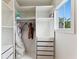 Organized walk-in closet with built-in shelving, hanging rods, and a window for natural light at 1474 Blue Cascade Dr, Mount Pleasant, SC 29464
