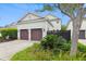 Detached two-car garage with a pergola and landscaped yard for added curb appeal at 1474 Blue Cascade Dr, Mount Pleasant, SC 29464