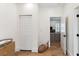Hallway providing an entry to a Bedroom and featuring a view into the living room, creating an open and connected living space at 1474 Blue Cascade Dr, Mount Pleasant, SC 29464