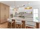 Modern kitchen with a large island, marble countertops, pendant lighting and ample cabinet space at 1474 Blue Cascade Dr, Mount Pleasant, SC 29464
