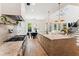 Open kitchen boasts marble counters, stainless appliances, and an island with bar seating at 1474 Blue Cascade Dr, Mount Pleasant, SC 29464