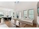 Bright and airy living room with hardwood floors, large windows, and access to the backyard at 1474 Blue Cascade Dr, Mount Pleasant, SC 29464