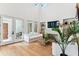 Bright living room boasts hardwood floors, high ceilings, fireplace, and access to patio at 1474 Blue Cascade Dr, Mount Pleasant, SC 29464