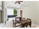 Cozy covered patio featuring a large dining table, string lights and an outdoor living area at 1474 Blue Cascade Dr, Mount Pleasant, SC 29464