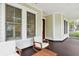 Relaxing covered porch with comfortable seating and natural light, perfect for entertaining at 1474 Blue Cascade Dr, Mount Pleasant, SC 29464