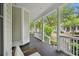 Spacious front porch with classic columns, providing a serene outdoor living area at 1474 Blue Cascade Dr, Mount Pleasant, SC 29464
