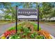Community street view showcasing the 'Watermark' entrance sign amid beautifully landscaped surroundings at 1474 Blue Cascade Dr, Mount Pleasant, SC 29464
