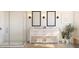 Bright primary bathroom with double vanity, framed mirrors, white tile, and chrome fixtures at 2042 Mcguire Ln # 011, Hollywood, SC 29449