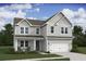 Charming two-story home featuring a classic architectural style and a well-manicured front lawn at 2042 Mcguire Ln # 011, Hollywood, SC 29449