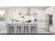 Modern white kitchen featuring stainless steel appliances, pendant lighting, and a center island with seating at 2042 Mcguire Ln # 011, Hollywood, SC 29449