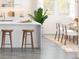 Kitchen showcasing white countertops, wooden stools, and ample natural light from nearby windows at 2042 Mcguire Ln # 011, Hollywood, SC 29449