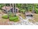 Aerial view of the property featuring a lush green lawn and a covered parking area at 205 Woodlawn St, Walterboro, SC 29488