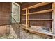 View of exterior back door with shelving and brick steps at 205 Woodlawn St, Walterboro, SC 29488