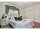 Comfortable bedroom featuring a plush bed, natural light, and closet at 205 Woodlawn St, Walterboro, SC 29488