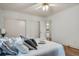 Bright bedroom with hardwood floors and view to ensuite bathroom through the open door at 205 Woodlawn St, Walterboro, SC 29488