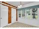 Bright breakfast nook featuring large windows, wood paneling, and stylish chandelier at 205 Woodlawn St, Walterboro, SC 29488
