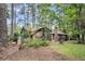 Exterior of home featuring mature trees and shrubs at 205 Woodlawn St, Walterboro, SC 29488
