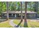 Charming single story home with brick foundation, porch, and mature trees at 205 Woodlawn St, Walterboro, SC 29488