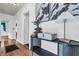 Bright entryway featuring hardwood floors, white walls, and a sleek console table with modern decor at 205 Woodlawn St, Walterboro, SC 29488
