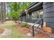 Charming front porch with brick steps and railing, complementing the home's exterior at 205 Woodlawn St, Walterboro, SC 29488