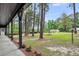 View of landscaped front yard and walkway from the porch at 205 Woodlawn St, Walterboro, SC 29488