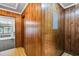 Hallway area with wood paneled walls at 205 Woodlawn St, Walterboro, SC 29488
