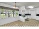 Eat-in kitchen with tile floor and large window at 205 Woodlawn St, Walterboro, SC 29488