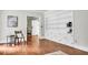 Bright living room with hardwood floors, a built-in bookcase, and charming details at 205 Woodlawn St, Walterboro, SC 29488