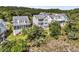Aerial view of a two-story home surrounded by lush greenery and neighboring homes at 2072 Amenity Park Dr, Mount Pleasant, SC 29466