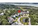 Drone view of a house and the surrounding neighborhood which includes a small pond at 2072 Amenity Park Dr, Mount Pleasant, SC 29466