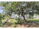 Backyard with seating and fire pit offering relaxing atmosphere, view of home, and wooded property at 2072 Amenity Park Dr, Mount Pleasant, SC 29466