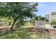 Lush backyard with seating and fire pit offering relaxing atmosphere and view of wooded property at 2072 Amenity Park Dr, Mount Pleasant, SC 29466