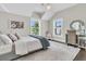 Cozy bedroom with white walls, a bed with decorative pillows, an area rug, and plenty of natural light at 2072 Amenity Park Dr, Mount Pleasant, SC 29466