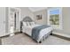 Bedroom with a gray bed, decorative pillows, an area rug, and a view from the window at 2072 Amenity Park Dr, Mount Pleasant, SC 29466